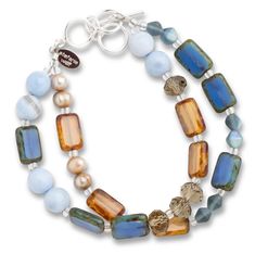 Inspired by the vast expanses of sky and land in Montana, this double strand bracelet features freshwater pearls, blue agate, crystals & Czech glass, with an adjustable sterling silver toggle closure. Adjusts from 7" - 8". Wolf Designs, Jewellery Showroom, Desert Sky, Wolf Design, Strand Bracelet, Blue Agate, Nature Bracelets, Colorful Bracelets, Agate Beads