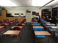 an empty classroom with desks and chairs