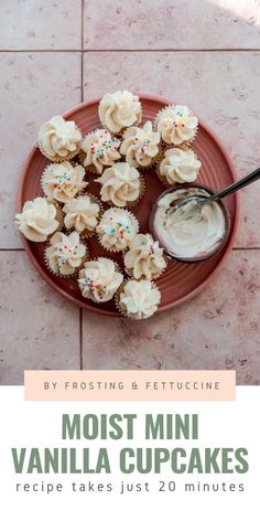 vanilla cupcakes with frosting and sprinkles on a pink plate