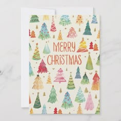 a christmas card with colorful trees on it