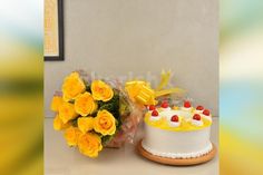 two cakes with yellow roses in front of them