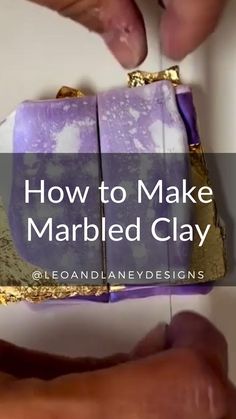 someone is holding a purple and gold box with the words how to make marbled clay