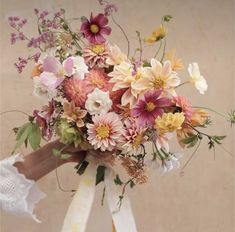 a bouquet of flowers sitting on top of a table