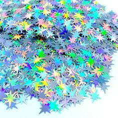 a pile of multicolored stars on a white background