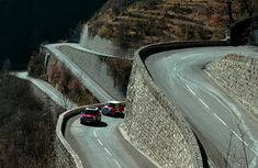 two cars driving down a winding road with the words cold de turni - france