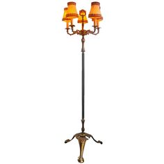 a floor lamp with three lamps on it