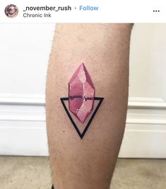 a man's leg with a pink diamond tattoo on it