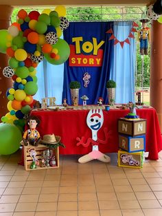 a toy story birthday party with balloons and decorations