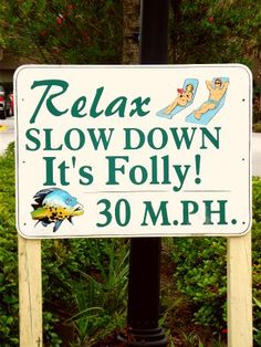 a sign that says relax slow down it's folly 30 mph