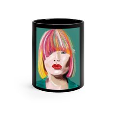 a black coffee mug with a painting of a woman's face and colorful hair