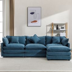 a living room with a blue sectional couch