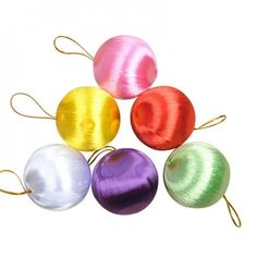 four different colored ornaments are shown in the shape of an ornament, and one is