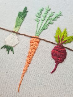 the carrots are being stitched together with thread