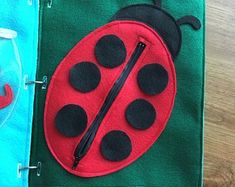 the ladybug is sitting on top of two towels