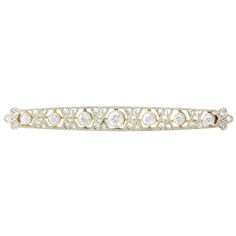 Antique Edwardian diamond pin, circa 1910. This antique pin is crafted in platinum and 18 karat yellow gold. The Edwardian pin features seven old European cut diamonds at .67 carat total weight with VS-SI clarity and H-J color. There are also 18 rose cut accent diamonds. [KIMH 244]   Dimensions .25″H x 2.25″W x .20″D Antique Pins, Jewelry Accessories Ideas, Diamond Bar, Eternity Band Diamond, Diamond Eternity, Hinged Bangle, Diamond Fashion, Rose Cut