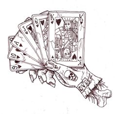 a hand holding four playing cards in it's palm