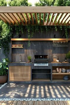 an outdoor kitchen that is built into the side of a building with plants growing on it