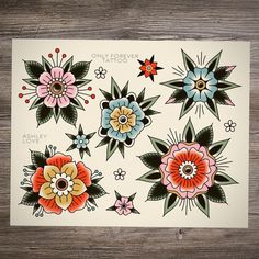 an assortment of flowers are shown on a piece of white paper with black and red accents