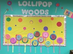 a bulletin board decorated with lollipops and candy