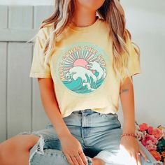 Hey there, Sunshine! Ready to brighten up your wardrobe with a touch of warmth and positivity? Embrace the sunshine with the "Here Comes The Sun" Comfort Color Tee – the perfect blend of comfort and optimism for your everyday adventures. Crafted from premium Comfort Color fabric, this tee offers unbeatable comfort and durability, perfect for soaking up the rays or enjoying a leisurely stroll under clear skies. The cheerful design features a playful nod to the iconic Beatles song, spreading joy wherever you go. Whether you're starting your day with a morning walk or unwinding in the afternoon sun, this tee is your go-to choice for casual comfort and laid-back style. Its relaxed fit ensures you stay cool and carefree, whether you're lounging in the park or catching up with friends over coffe Spring Leisure Graphic Tee Tops, Summer Crew Neck Tops For Warm Weather, Summer Crew Neck Top, Crew Neck Tops For Summer Warm Weather, Comfortable Graphic Print Tops For Leisure, Yellow Soft-washed Graphic Tee, Yellow Soft-washed Crew Neck Top, Yellow Soft-washed Casual Tops, Casual Soft-washed Yellow Top