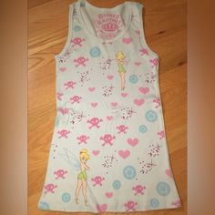 Disney Couture Vintage Tinker Bell & Skull Tank Rare Find Form Fitting Ribbed Tank 100% Cotton Pit To Pit Approx 13in Large Nwt No Trades Smoke Free Home Final Sale No Returns New Never Worn Or Tried On. Never Came With A Tag Came In A Bag Price Firm Poshmark Putting 20% Fees Back On Sellers Is Now Affecting Prices. Vintage Tinkerbell, Skull Tank Top, Disney Couture, Skull Tank, Couture Vintage, Tinker Bell, Ribbed Tank, A Bag, Girly Things