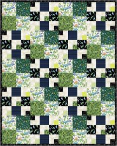 a patchwork quilt with green and blue squares