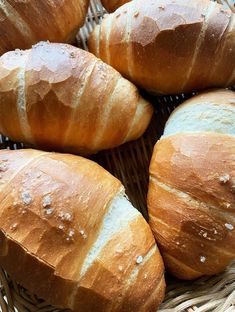 several loaves of bread sitting in a basket