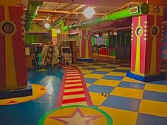 an indoor play area with brightly colored tiles