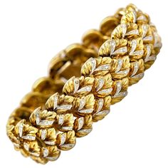 Bracelet, finely crafted in 18k yellow gold with diamonds weighing 39.9 dwt. Length of the bracelet is 7inch/18cm and the width is 0.75 inch/2 cm. Circa 1950's. 18k Gold Jewelry 1stdibs, Luxury Yellow Gold Multi-strand Jewelry, Gold Jewelry 1stdibs, Luxury Gold Jubilee Bracelet Collectible, Luxury Gold Costume Jewelry Bracelets, Luxury Gold Costume Jewelry Bracelet, Luxury Yellow Gold Exquisite Bracelets, Luxury Vintage Yellow Gold Jewelry, Luxury Vintage Gold Diamond Bracelet