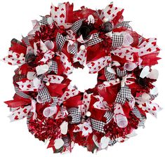 a red and white wreath with hearts, bows and ribbons on the front of it