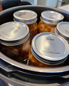 six jars of pickles in an electric pressure cooker