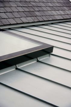 an image of a roof that has metal shingles on it