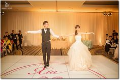 a bride and groom are dancing on the dance floor