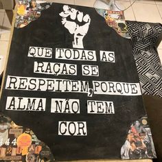 a black sign with white writing on it and some pictures around it that say, que toddas as racases se respettem porque alam no tem cor