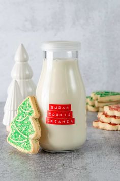 a bottle of milk next to some cookies