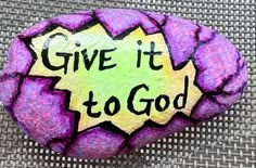 a rock with the words give it to god painted on it