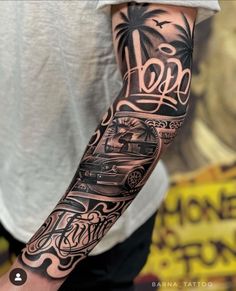 a man with a tattoo on his arm that has cars and palm trees in it