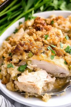 a white plate topped with chicken and stuffing