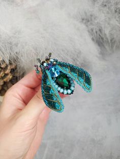 "Beautiful beetle brooch (cicada brooch) is lovely handmade by me. 💓 This beautiful hand embroidered beetle brooch (cicada brooch) took hours of precision and elaborate embroidery work. This cicada brooch will be a wonderful gift to a very special person! SIZE Brooch size ~ 2.16\" * 2.75\" (5.5 * 7 cm) MATERIALS Made of czech, japanese seed beads, glass crystals and sequins. Beaded jewelry requires careful and loving care. Avoid contact with hairspray, perfume, water, bleaches & lotions. Av Unique Handmade Green Brooches, Handmade Unique Brooches For Crafting, Embroidered Beetle, Cicada Brooch, Elaborate Embroidery, Beetle Brooch, Bug Brooch, Insect Brooch, Embroidered Brooch