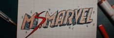 the word marvel is drawn on top of a piece of paper