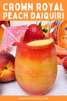 a close up of a drink in a glass with strawberries and peaches around it