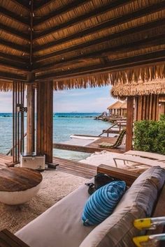 an outdoor living area overlooking the ocean