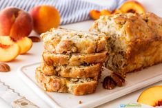 sliced peach and pecan bread on a white plate