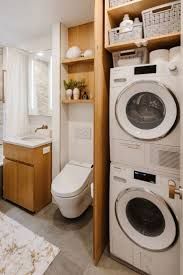 a washer and dryer in a small bathroom