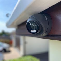 an outdoor security camera mounted on the side of a building