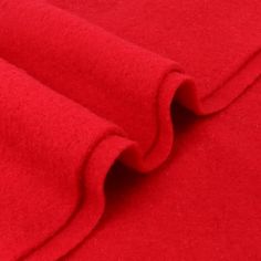 a close up shot of a red fabric textured with wool and polyestere