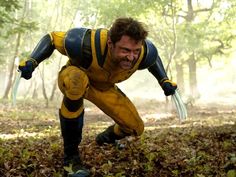 a man dressed as wolverine in the woods