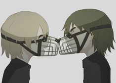 two people with masks on their faces facing each other