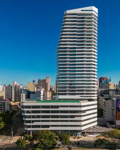 an aerial view of a tall building in the city