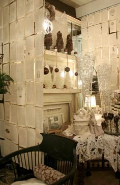 a living room filled with furniture next to a fire place covered in frosted paper